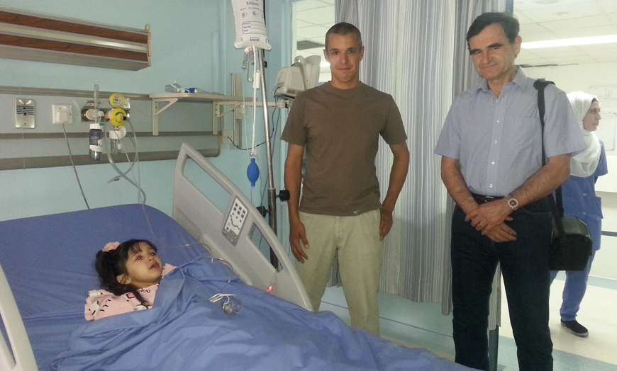  Paediatric cardiologists Tomáš Tláskal and Petr Bukovsk with five-year-old Ajmal Fayez at Al Khalidi Medical Centre (Photo by Dana Al Emam )